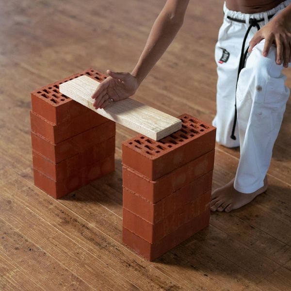 Man in a plank position demonstrating stability and discipline.